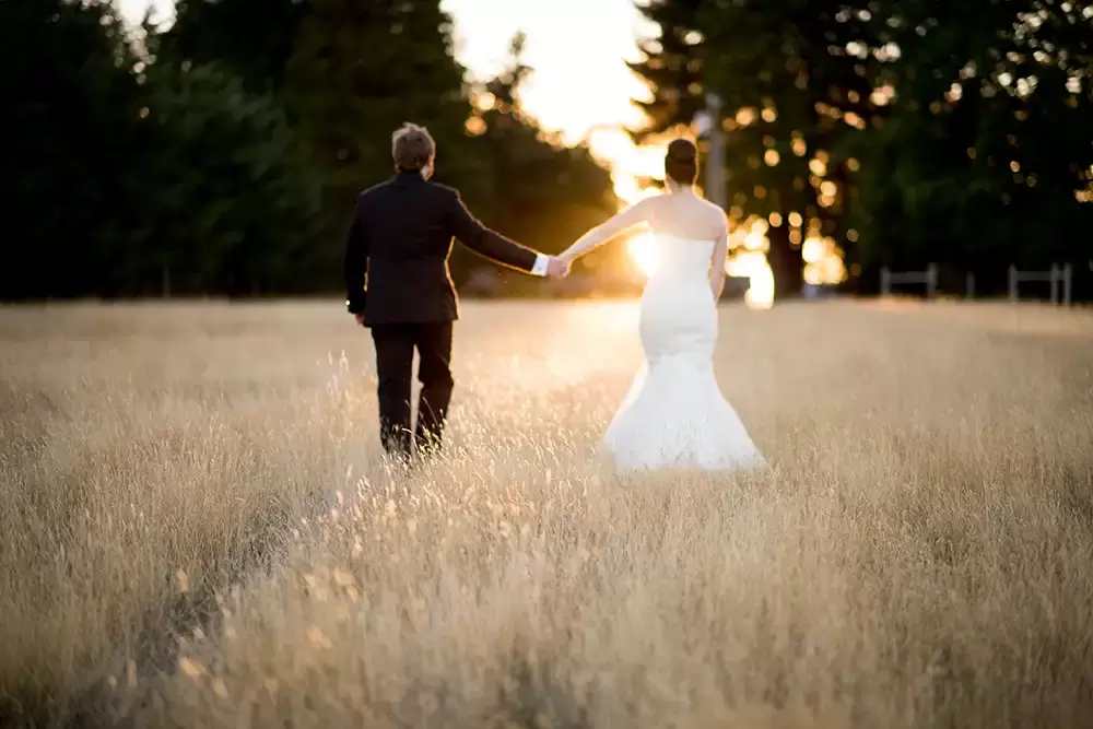 Farm Wedding Oregon
Rustic ​Chic Style with Robert Knapp Photographer the tall grasses are lit only on the top. Sunset is nearly complete, this couple holds hands and walks to the distance