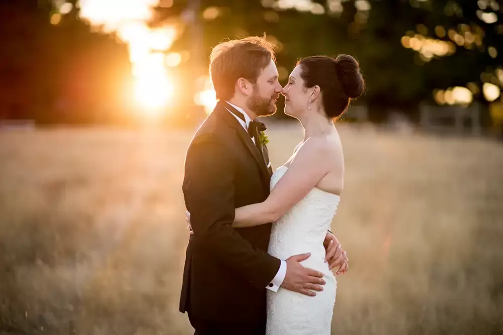 Farm Wedding Oregon
Rustic ​Chic Style with Robert Knapp Photographer nuzzling noses this couple  is standing in sunset light in a wedding dress and tux