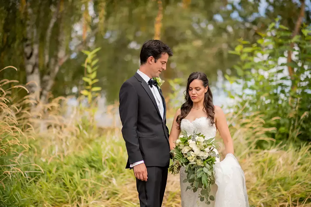bride and groom talk at A ​Sauvie Island Wedding from Photographer ​Robert Knapp 