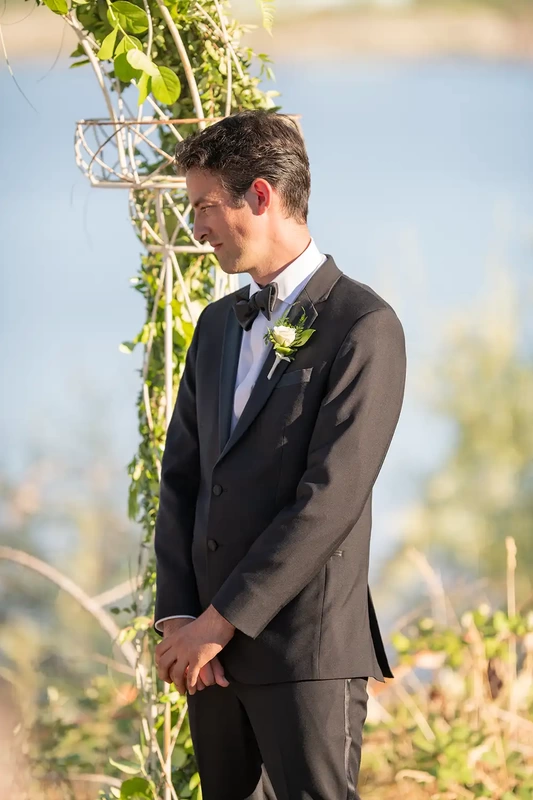 a close up of a groom standing during the ceremony at a A ​Sauvie Island Wedding from Photographer ​Robert Knapp 
