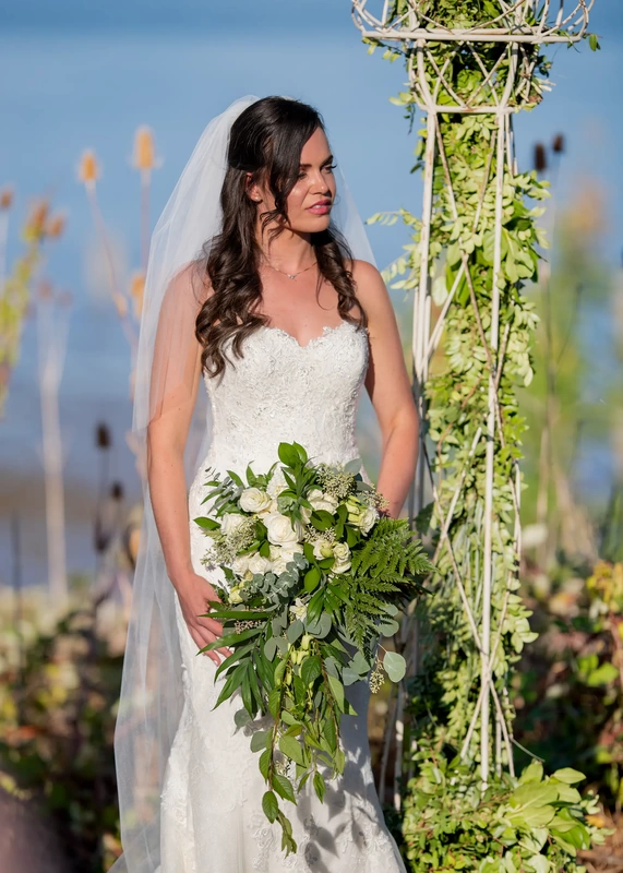 ​Sauvie Island Wedding from Photographer ​Robert Knapp bride portrait at the ceremony wearing a veil and an amazing strapless mermaid cut dress at A Sauvie Island Wedding from Photographer Robert Knapp