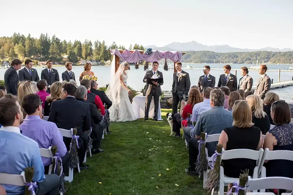 Alderbrook Resort Weddings
from ​Photographer Robert Knapp Wedding ceremony taking place. All the guests are seated the bridal party is standing at attention.
