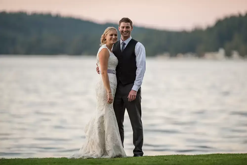 Alderbrook resort weddings timer for robert knapp Friday bride and groom stand on the waterfront in front of the resort