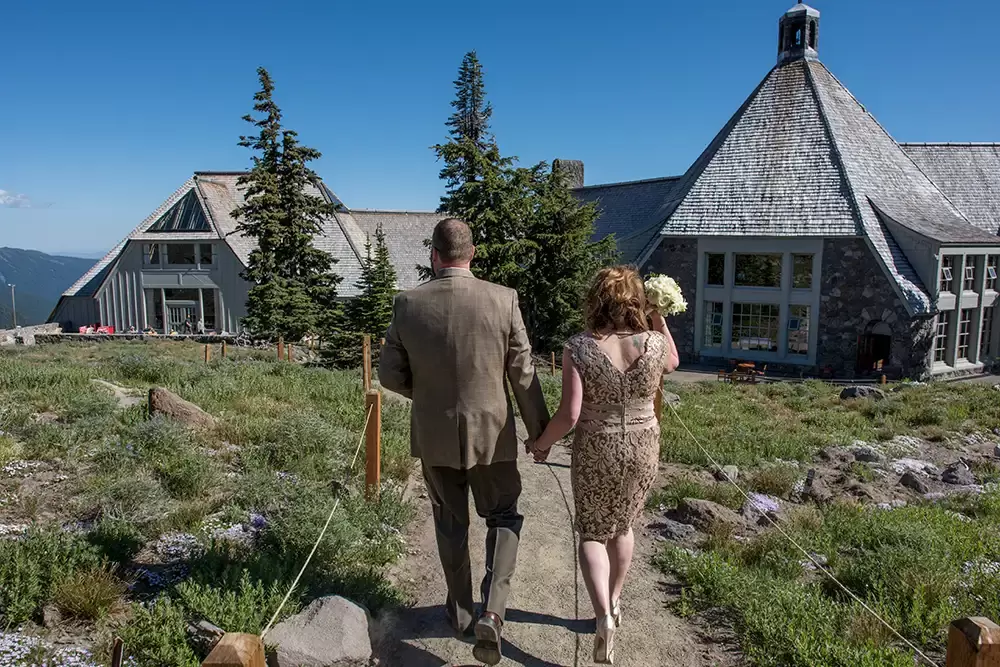 Wedding at Timberline Lodge bride and groom walk to the lodge