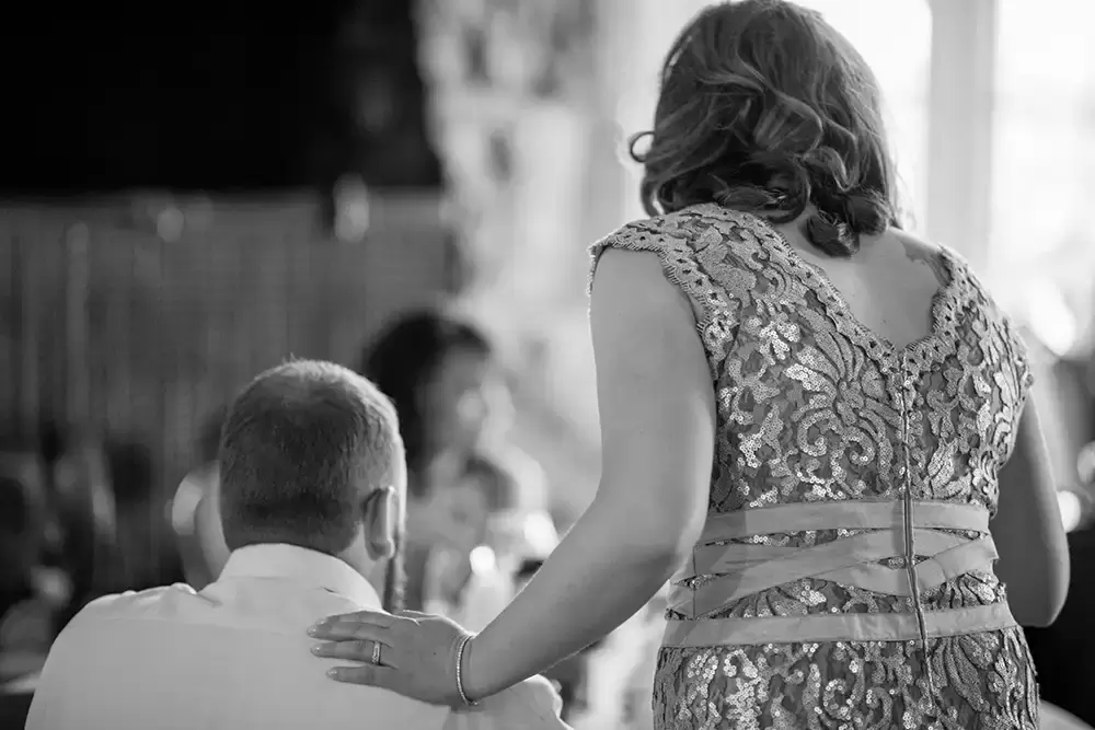 Wedding at Timberline Lodge ​from photographer Robert Knapp bride rests her hand on the grooms should as he speaks to another guest Breathtaking Photography from
a
Wedding at Timberline Lodge