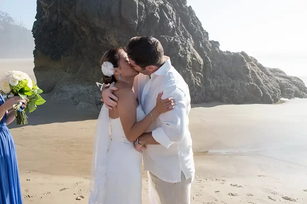 Wedding on the Beach
Cannon Beach Wedding
Photographer Robert Knapp the kiss at the end of the ceremony