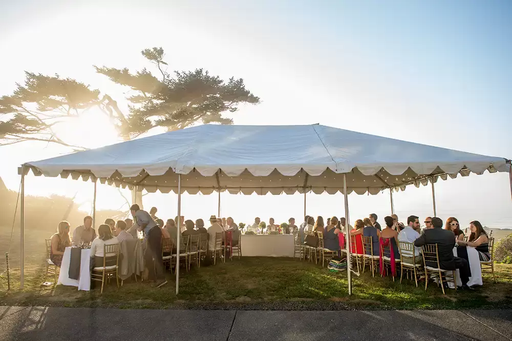 Wedding on the Beach
Cannon Beach Wedding
Photographer Robert Knapp the party tent that covers the seating, is shaped in a giant U shape