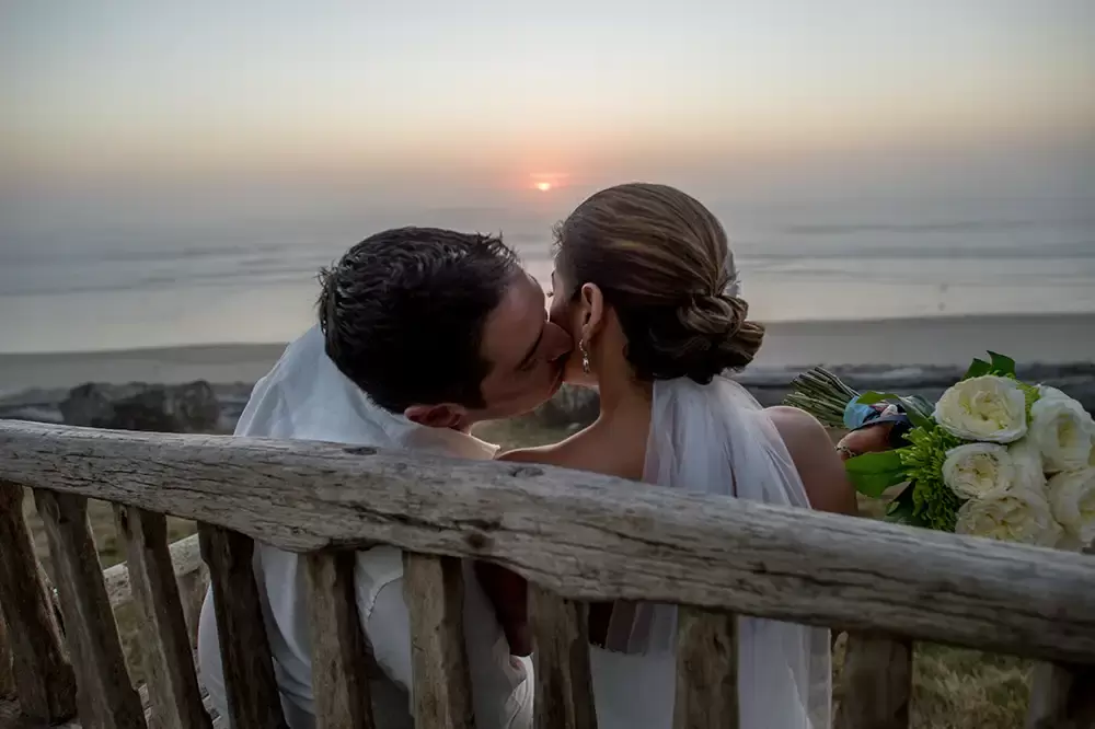 Wedding on the Beach
Cannon Beach Wedding
Photographer Robert Knapp sunset the groom kisses the bride on the beach