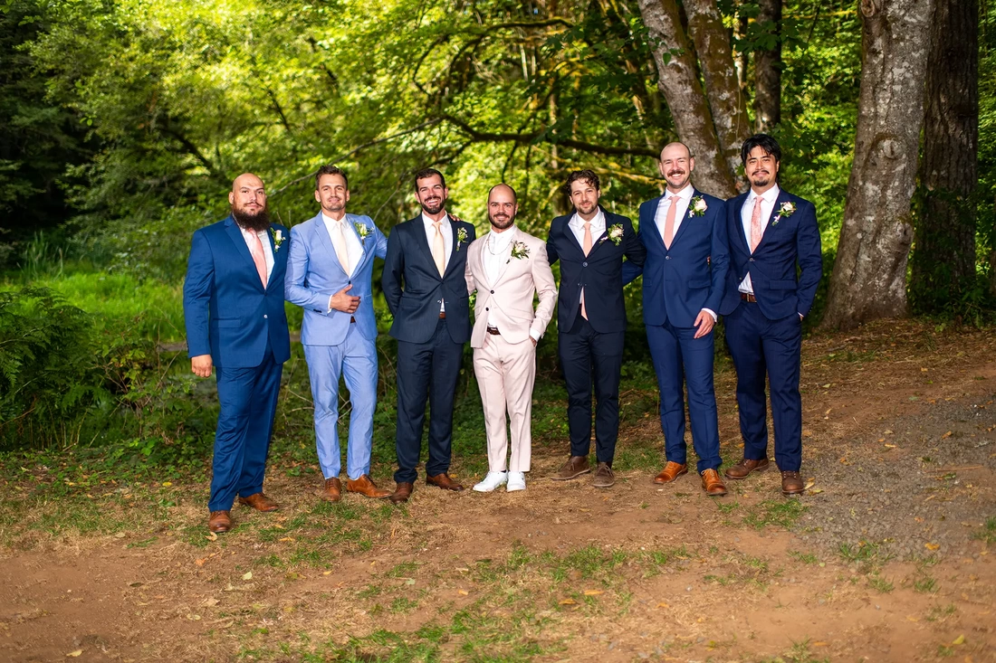 a group of groomsmen stand in the woods together Beautifully lit Horning's Hideout Wedding; Modern Art Photograph