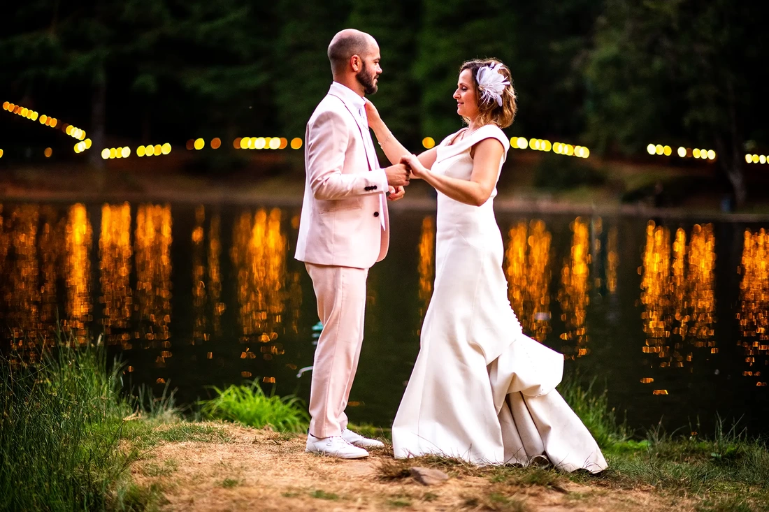 bride and groom stand in the evening light Beautifully lit Horning's Hideout Wedding; Modern Art Photograph