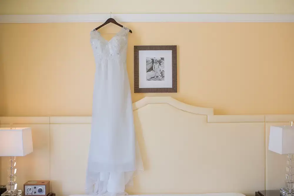 Hotel Deluxe Wedding in Portland Oregon
by Photographer Robert Knapp the wedding dress hangs from the trim in a suite at the hotel deluxe