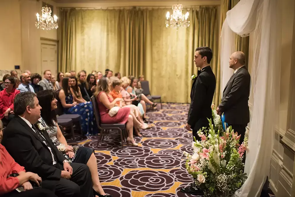 Hotel Deluxe Wedding in Portland Oregon
by Photographer Robert Knapp the groom stands at the ceremony waiting for the bride to arrive