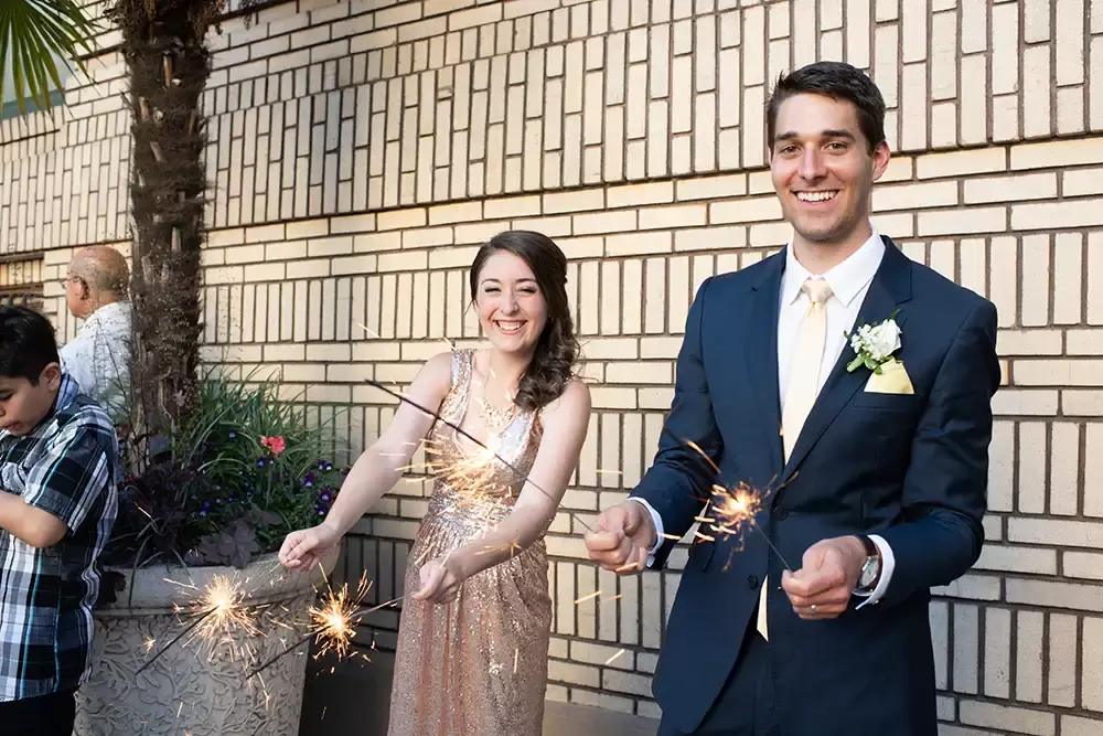 Hotel Deluxe Wedding in Portland Oregon
by Photographer Robert Knapp wedding guests hold sparklers