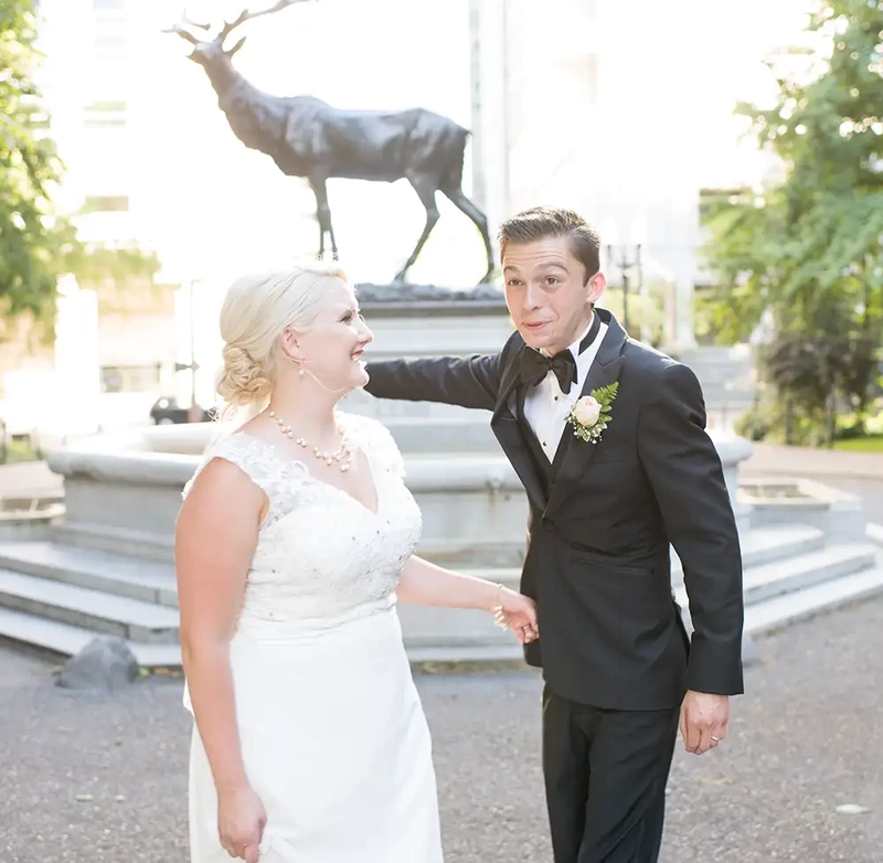 Hotel Deluxe Wedding in Portland Oregon
by Photographer Robert Knapp the bronze stag impresses this groom , the bride watches the groom