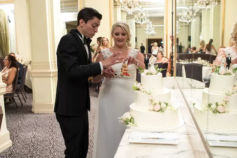 Hotel Deluxe Wedding in Portland Oregon
by Photographer Robert Knapp bride and groom cut the cake
