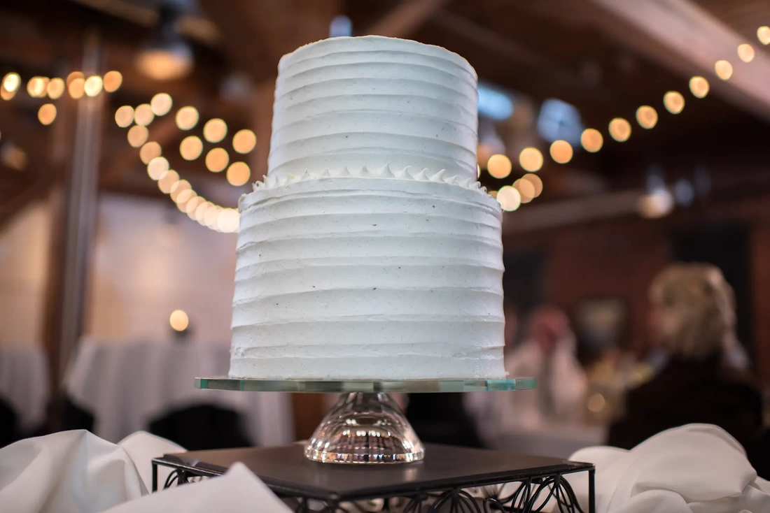 the wedding cake on the desert table at a brewery LGBT Wedding Photographer Robert Knapp at ​Tanner Springs Park in Portland Oregon