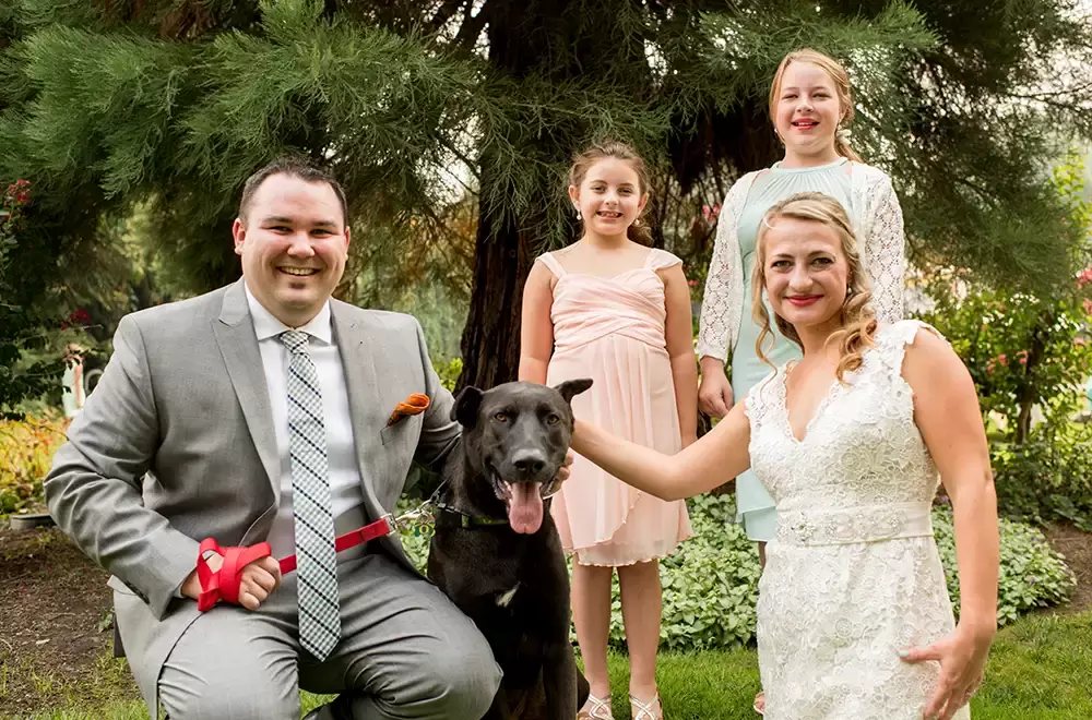 McMenamins Grand Lodge Weddings where a family stands together with their dog before the wedding