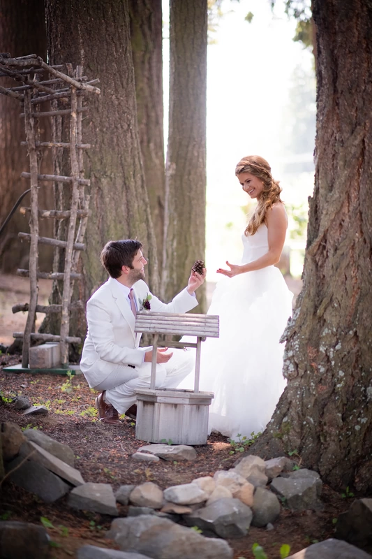 groom on one knee offering a pinecone, bride is unsure Millers Farm Weddings, Photography from Modern Art Photograph