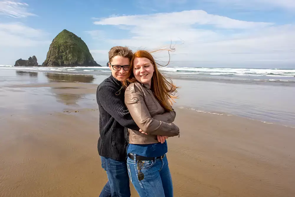bright smiles as a man and woman hug on the beach Modern Art Photograph 
Engagement Photography Portland Oregon