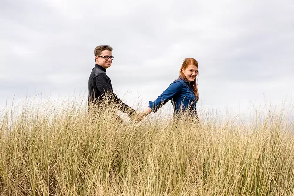 a couple walks in the sea grass Modern Art Photograph 
Engagement Photography Portland Oregon