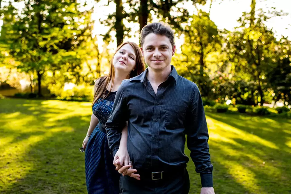 sunset twinkles through the trees for a couple Modern Art Photograph 
Engagement Photography Portland Oregon