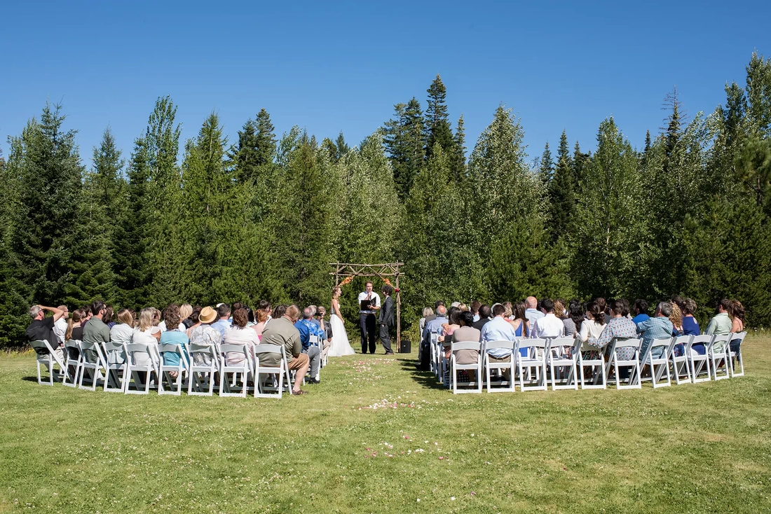 Mount Hood Weddings Capturing The Moment with Photojournalist Wedding Photographer Robert Knapp  for you can look just like this ceremony on a lawn with flower petals scattered