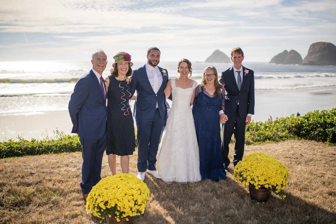 Wedding Photographers Near Me | Modern Art Photograph Wedding Photography from Oceanside, Oregon a family photo bride and groom pose with the parents bride and groom celebrate the wedding ceremony ending Wedding Photography from Oceanside, Oregon Wedding Photographers Near Me | Modern Art Photograph