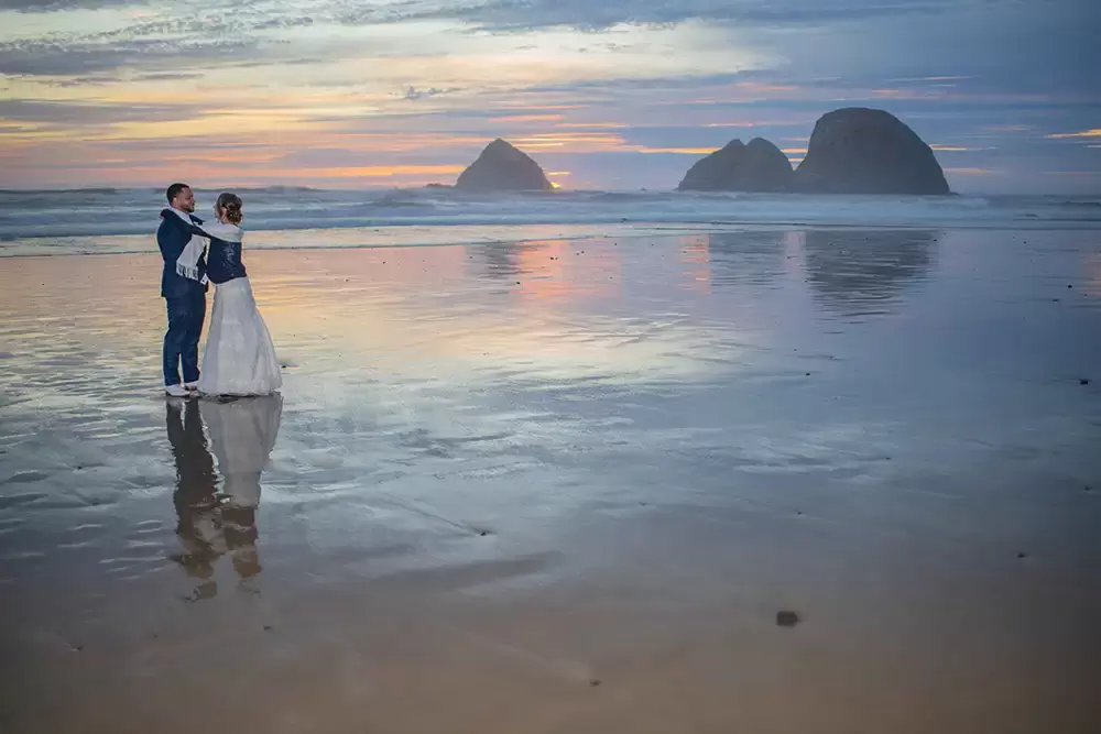 Wedding Photographers Near Me | Modern Art Photograph
Wedding Photography
from Oceanside, Oregon bride and groom stand in the wet sand reflecting their image in Oceanside Oregon