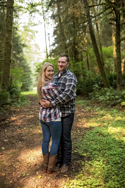 a couple turns to look toward the camera Oregon Coast Engagement Photos 
With 
Modern Art Photograph