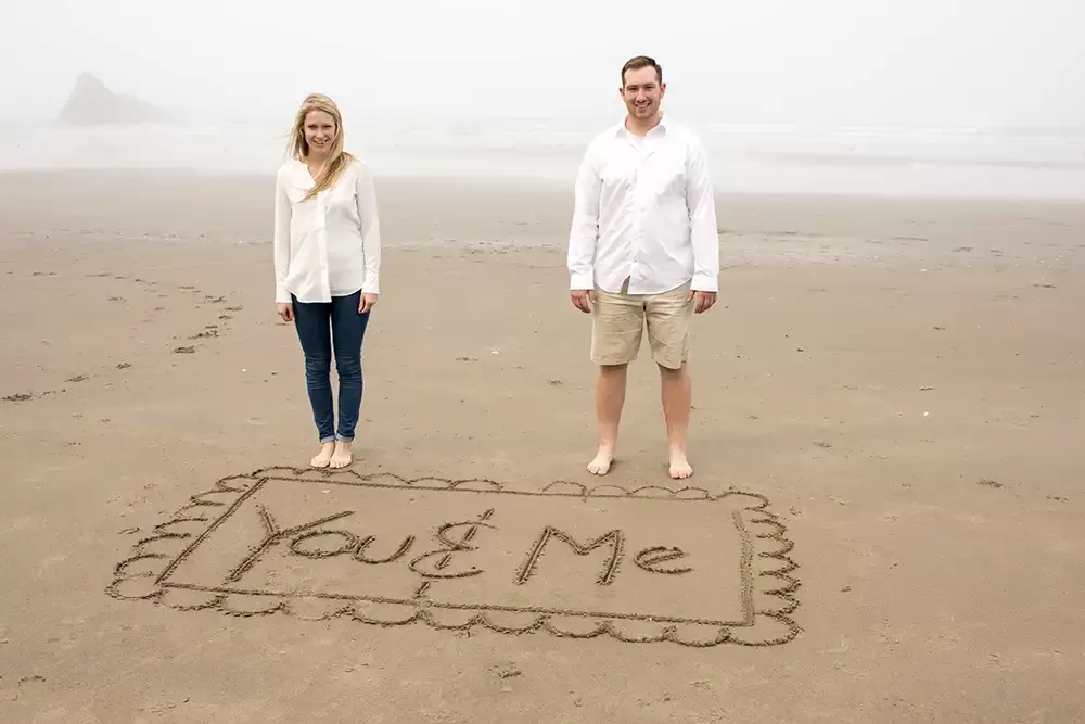 write a message in the sand for the engagement photos that reads you and me Oregon Coast Engagement Photos 
With 
Modern Art Photograph
