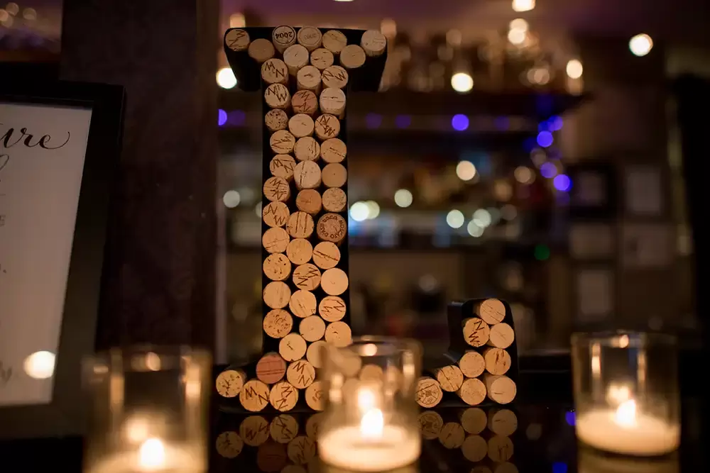 Oregon Wedding Photographers at Modern Art Photograph on location at opal 28 A collection of wine corks in the shape of an L