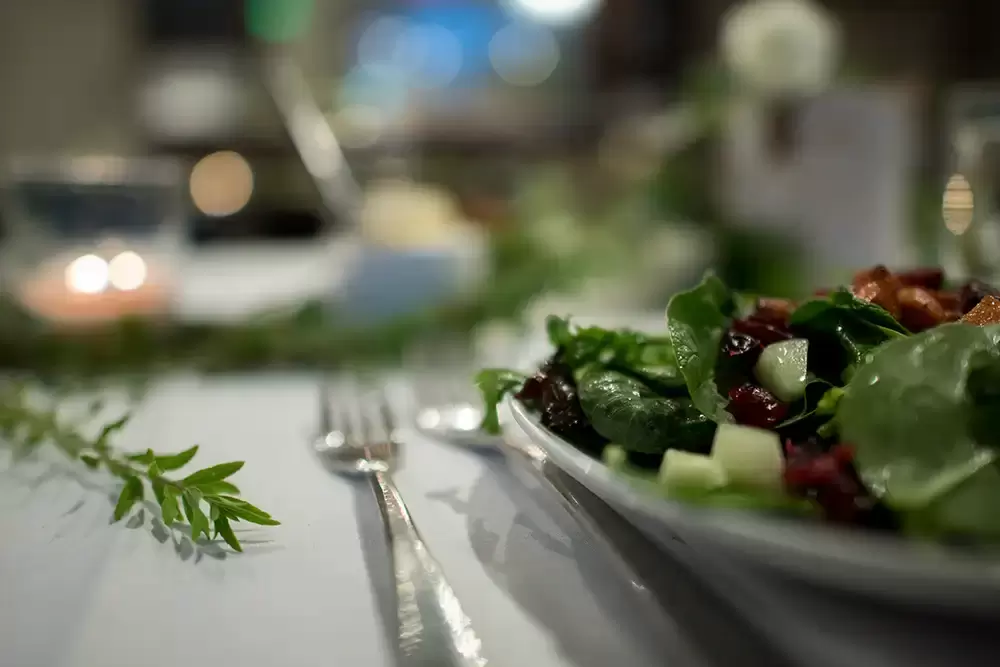 Oregon Wedding Photographers at Modern Art Photograph on location at opal 28 A close-up of a salad table setting out of focus