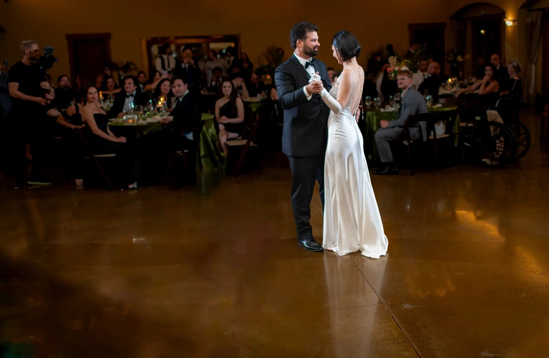 Bride and groom share a first dance at the wedding reception 