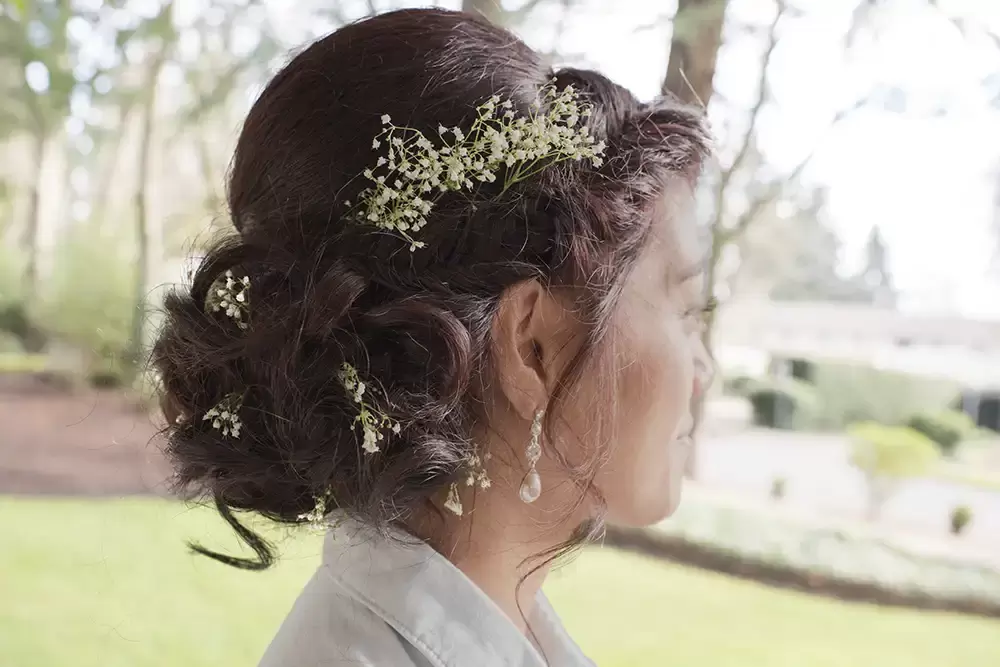 Grey gables estate, a brides hair is complete, she looks off to the side so I can photograph it for her properly.