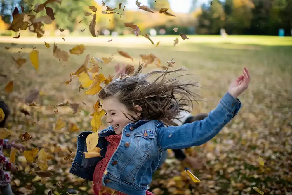 How much do family portraits cost Robert Knapp catches a great photo of a little girl tossing leafs in the air