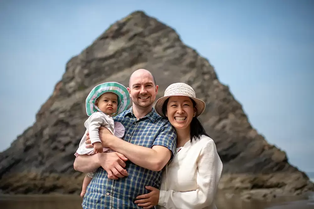 a family smiles to the camera together Portland ​Family Photographer Robert Knapp - Book Today!
