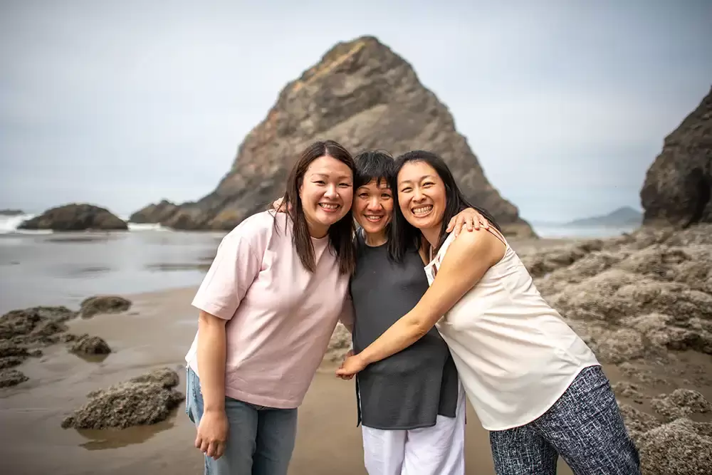 Two adult children, I was with their mother and smile the ocean, and some rocks are in the background​Family Photographer Robert Knapp in Portland - Book Today!