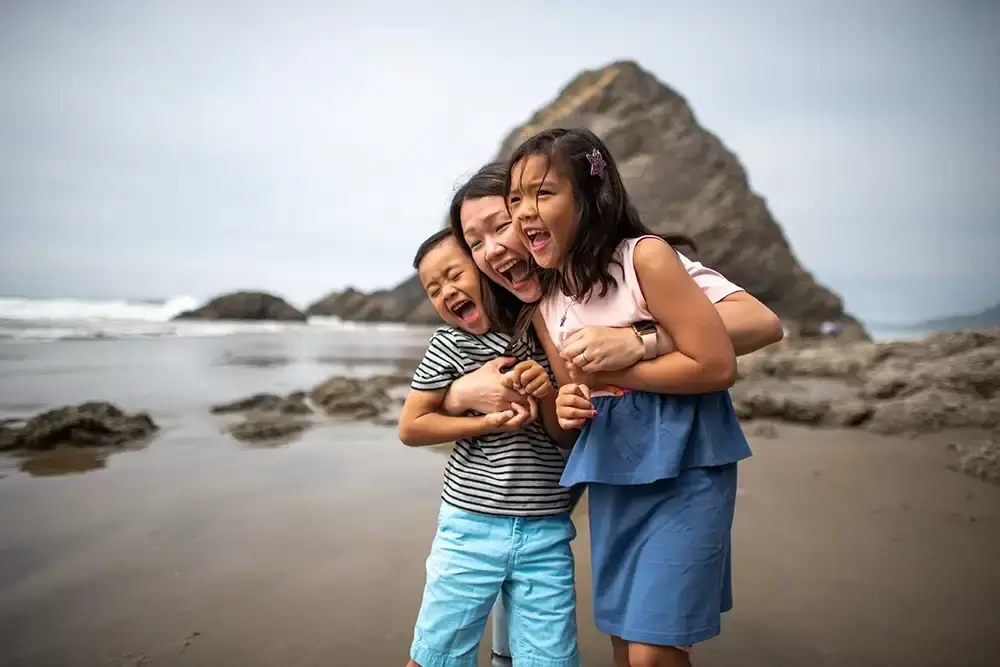 Oh, mother and children, smile and laugh waves in rocks in the background Portland ​Family Photographer Robert Knapp - Book Today! ​Family Photographer Robert Knapp in Portland - Book Today!