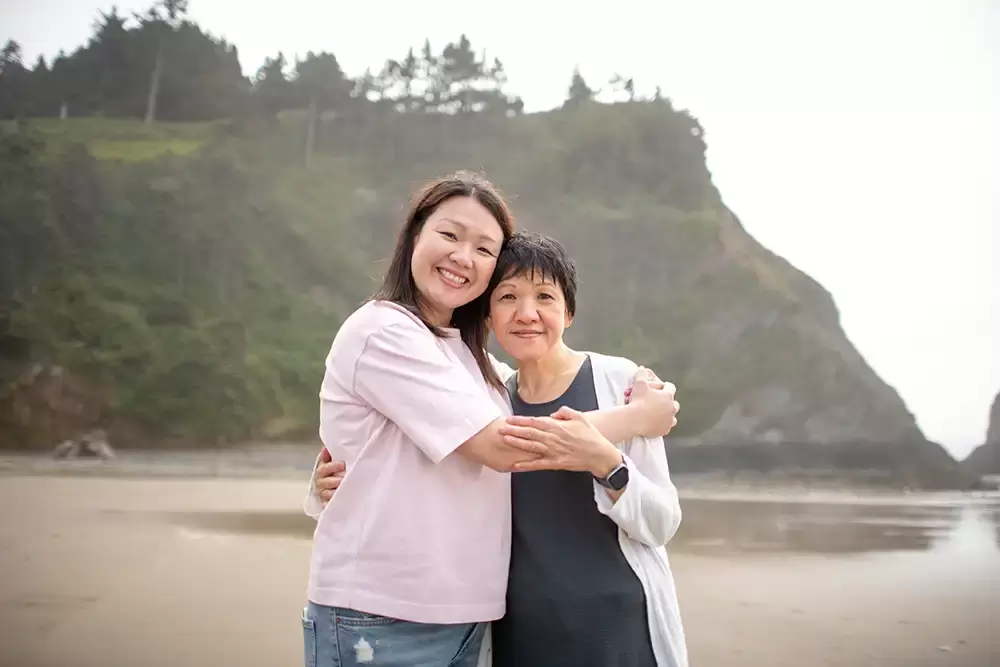 Mother and daughter on the beach smiling together Portland ​Family Photographer Robert Knapp - Book Today!​Family Photographer Robert Knapp in Portland - Book Today!