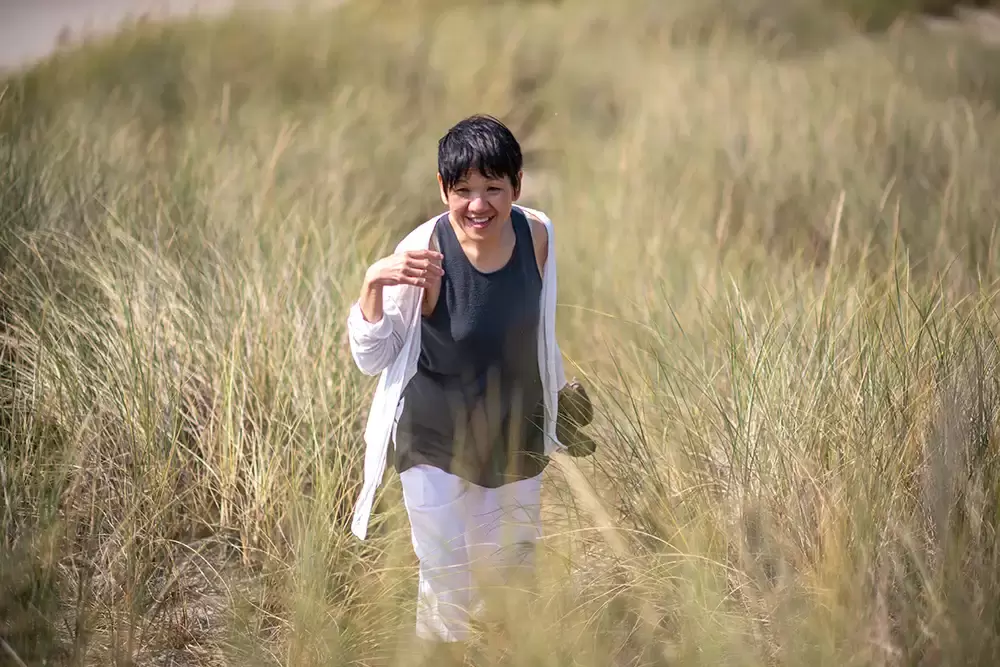 Grandma walks on the path through the dunes. See grasses are all around. Portland ​Family Photographer Robert Knapp - Book Today! ​Family Photographer Robert Knapp in Portland - Book Today!