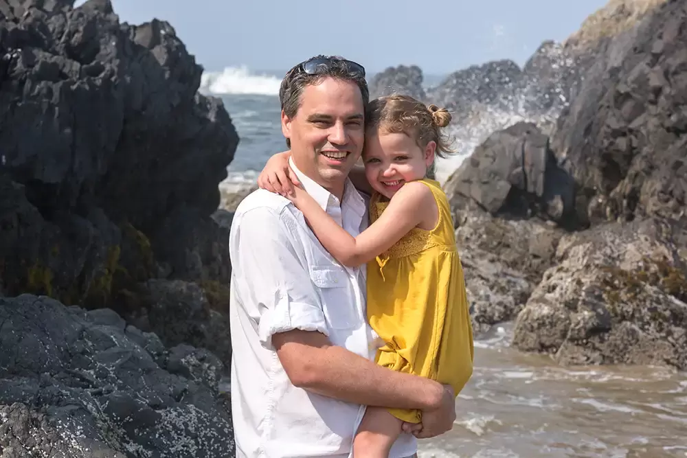 photography session with father and daughter as the waves crash on the rocks   Family Pictures Beach Theme with Portland Family Photographer Robert Knapp