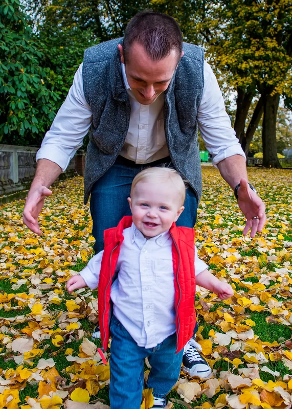 father runs after a son on the brightly colored leafs of fall that cover a garden Family Photography by Robert Knapp in Portland City Parks Portland Family Photographers
on Location 
City Parks