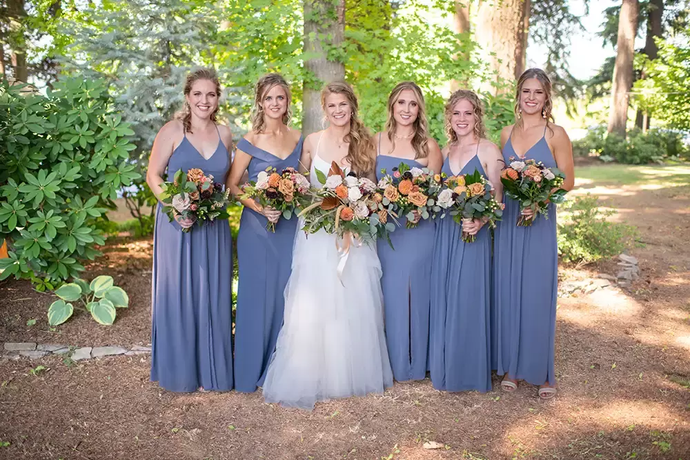 Portland Oregon Wedding Photographer Robert Knapp at ​Miller Farm bride and bridesmaids stand with flowers