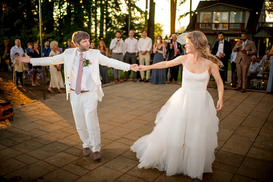 Portland Oregon Wedding Photographer Robert Knapp at ​Miller Farm Bride and groom dance and laugh they are both very happy.