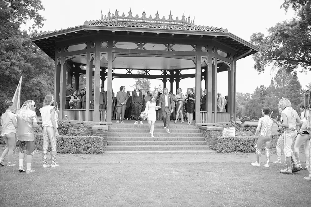 The ceremony is complete the bride and groom, walk down the steps of the gazebo the band is kicking into action