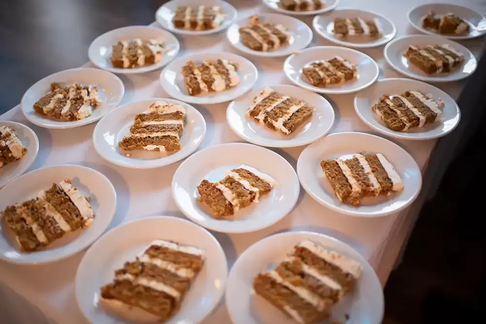 Polaris Hall
Portland Oregon Wedding Venue
Photographer Robert Knapp at Modern Art Photograph A table of plated slices of cake many slices of cake, fill the photograph