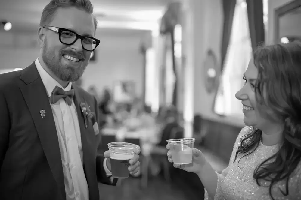 Polaris Hall
Portland Oregon Wedding Venue
Photographer Robert Knapp at Modern Art Photograph Bride and groom are having a drink together room looks at the camera bride looks to the groom. They are very happy.