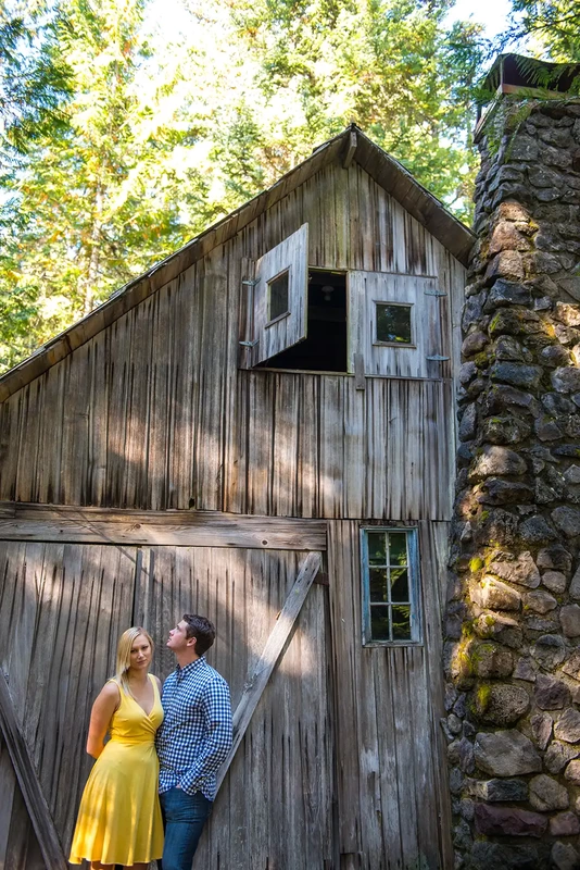 a couple poses in front of a found cabin in the woods Unforgettable Moment - Mountain Engagement Photos 
with
​ Photojournalist Photographer Robert Knapp
