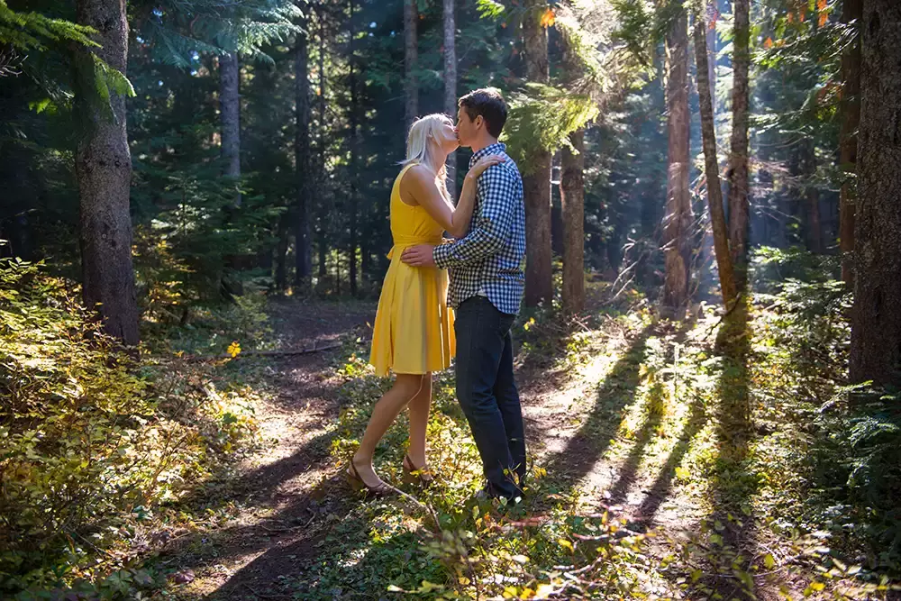 a couple kisses on a mountain engagement photos shoot Unforgettable Moment - Mountain Engagement Photos 
with
​ Photojournalist Photographer Robert Knapp