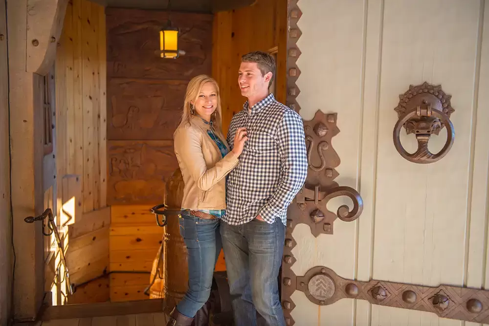 mountain engagement photos posing inside a vintage log lodge Unforgettable Moment - Mountain Engagement Photos 
with
​ Photojournalist Photographer Robert Knapp